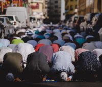 people kneeling and praying during daytime
